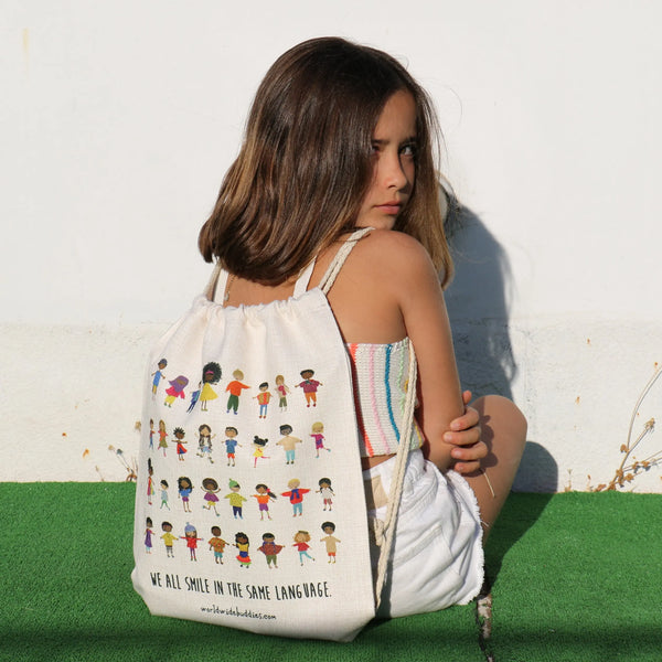 Smiles Drawstring Bag by Worldwide Buddies Worldwide Buddies