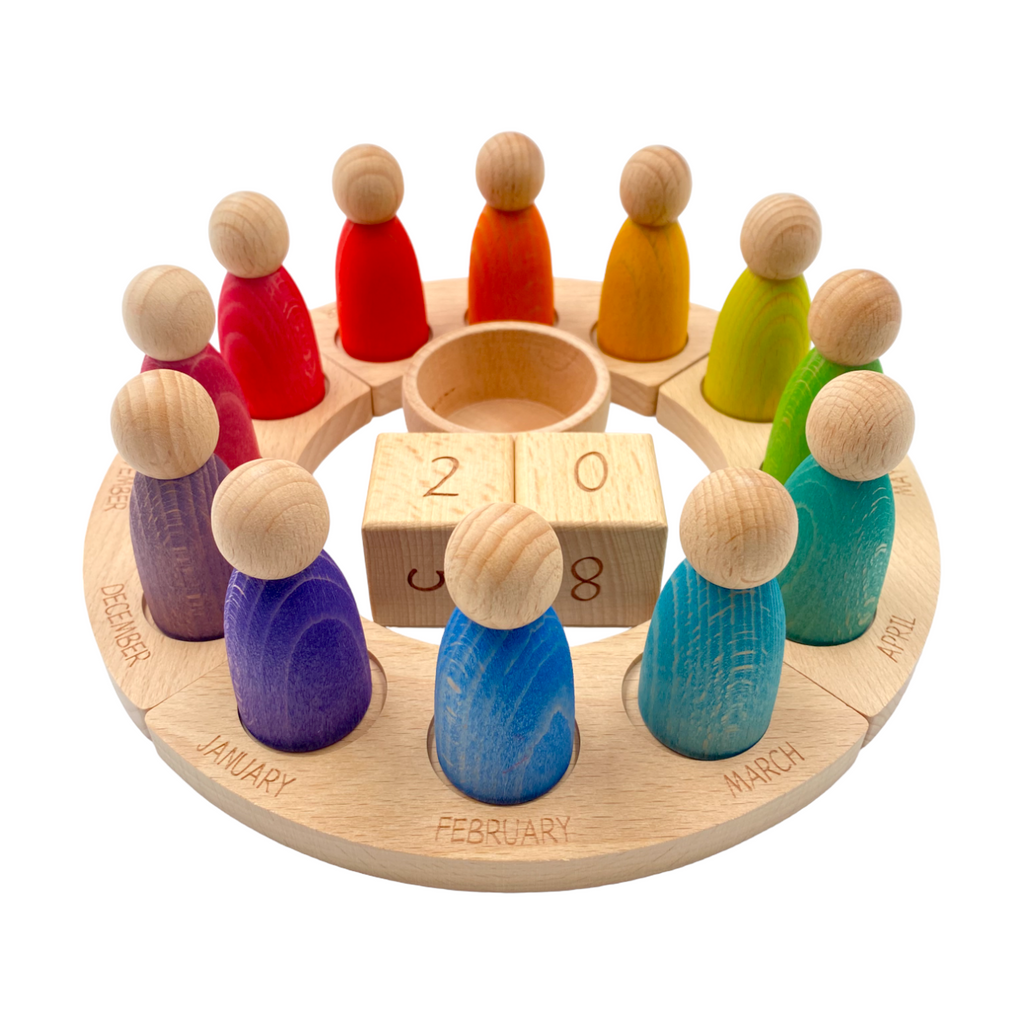 Wooden Perpetual Calendar with 12 Stained Rainbow Peg Figures |  | The Baby Penguin
