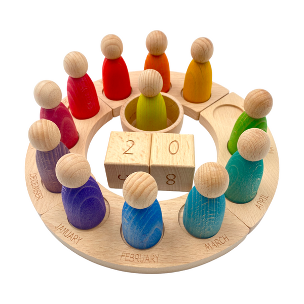Wooden Perpetual Calendar with 12 Stained Rainbow Peg Figures |  | The Baby Penguin